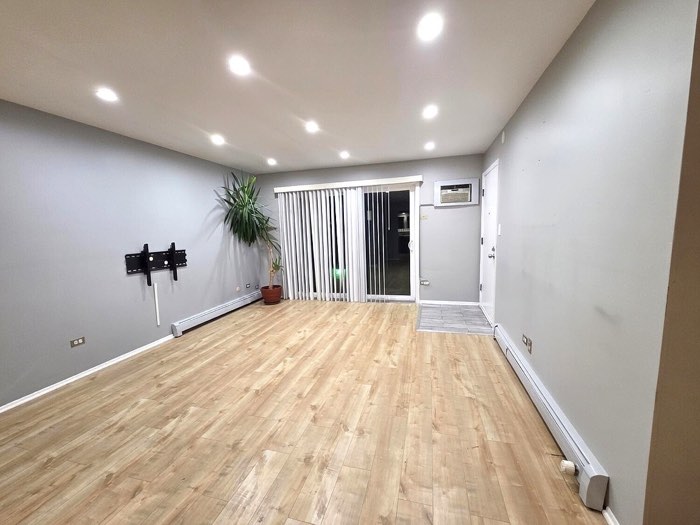 Living room — open, top-floor corner unit