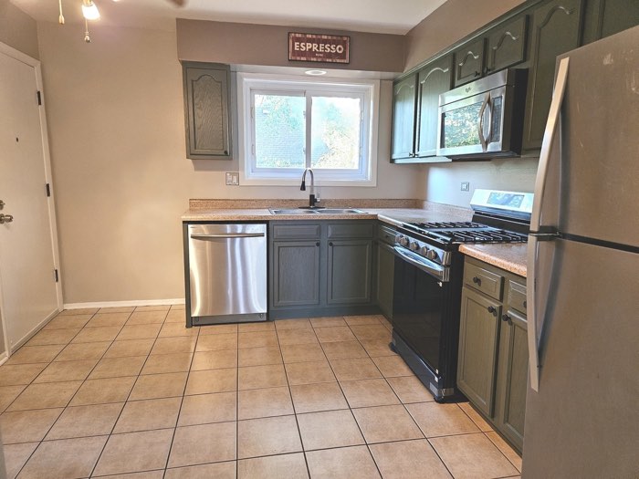 Kitchen with dishwasher and gas range